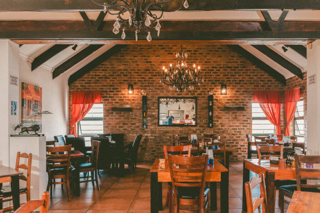 The dining room at Gavin's Trattoria, furnished with refurbished and reutilised tables