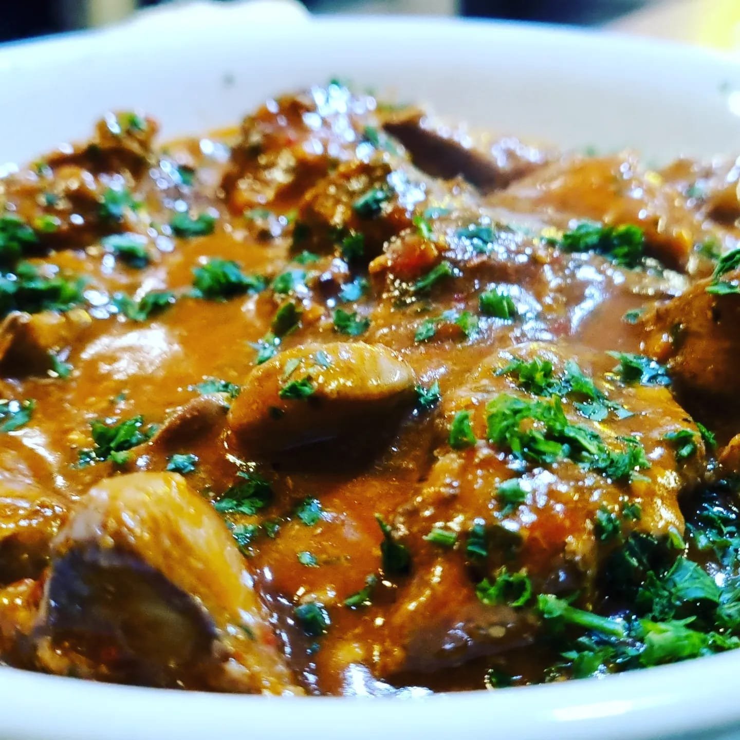 A rich, slow-cooked stew finished with fresh parsley