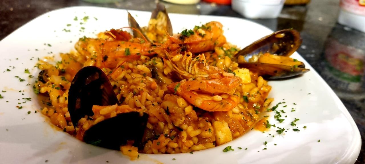 Seafood risotto with mussels and queen prawns